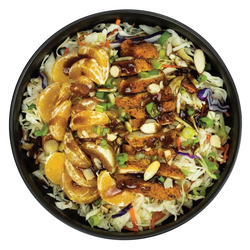 Mandarin salad with almond crusted chicken, slaw, almonds, green onions, sesame seeds and coconut amino dressing